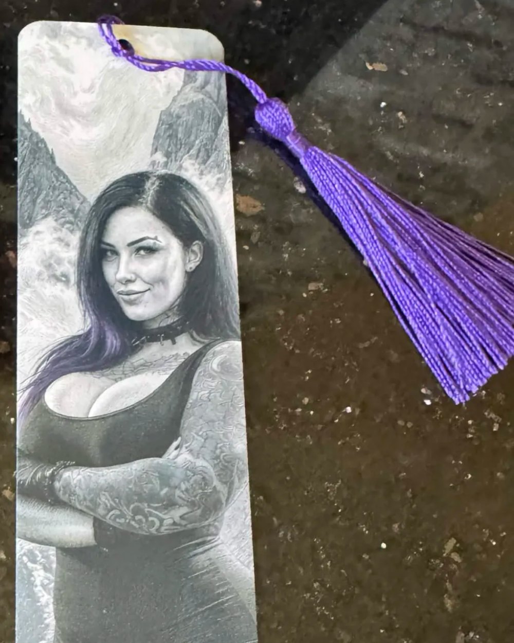 Sage bookmark with a purple tassel.